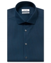 Check off easy-care and simple style from your list of business needs with this no-iron, slim-fit dress shirt from Calvin Klein. Check off easy-care and simple style from your list of business needs with this no-iron, slim-fit dress shirt from Calvin Klein.
