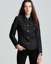 Burberry Brit takes the classic approach to chic, everyday outerwear in this flattering quilted jacket. Pair with all your favorite winter wares. Burberry Brit takes the classic approach to chic, everyday outerwear in this flattering quilted jacket. Pair with all your favorite winter wares.