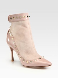 Studded patent leather pairs with suede in this lust-worthy point toe silhouette. Patent leather-covered heel, 3¼ (80mm)Suede and patent leather upper with metal studsPoint toeBack zip and button closureLeather liningBuffed leather solePadded insoleMade in ItalyOUR FIT MODEL RECOMMENDS ordering one half size up as this style runs small. Studded patent leather pairs with suede in this lust-worthy point toe silhouette. Patent leather-covered heel, 3¼ (80mm)Suede and patent leather upper with metal studsPoint toeBack zip and button closureLeather liningBuffed leather solePadded insoleMade in ItalyOUR FIT MODEL RECOMMENDS ordering one half size up as this style runs small.