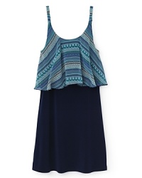 An elegant dress from Sally miller built around a solid, flowing skirt and pleated print overlay, falling from the shoulders. An elegant dress from Sally miller built around a solid, flowing skirt and pleated print overlay, falling from the shoulders.
