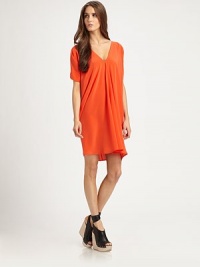 Elegant silk v-neck with dropped shoulders, front shirring and a chic hi-low hem. V-neckDropped shouldersShort sleevesShirred hi-low hemPull-on styleAbout 19 from natural waistSilkDry cleanImportedModel shown is 5'11 (180cm) wearing US size Small. Elegant silk v-neck with dropped shoulders, front shirring and a chic hi-low hem. V-neckDropped shouldersShort sleevesShirred hi-low hemPull-on styleAbout 19 from natural waistSilkDry cleanImportedModel shown is 5'11 (180cm) wearing US size Small.