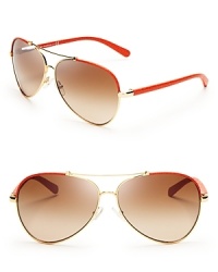 Fly to new style heights in these stylish Tory Burch aviator sunglasses, with stylish textured leather arms in the haute color of the season. Fly to new style heights in these stylish Tory Burch aviator sunglasses, with stylish textured leather arms in the haute color of the season.