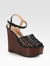 Mesh-like woven leather with an adjustable ankle strap, finished with a chunky wooden wedge and platform. Wooden wedge, 5 (125mm)Wooden platform, 2 (50mm)Compares to a 3 heel (75mm)Leather upperLeather liningRubber solePadded insoleImportedOUR FIT MODEL RECOMMENDS ordering one half size up as this style runs small. Mesh-like woven leather with an adjustable ankle strap, finished with a chunky wooden wedge and platform. Wooden wedge, 5 (125mm)Wooden platform, 2 (50mm)Compares to a 3 heel (75mm)Leather upperLeather liningRubber solePadded insoleImportedOUR FIT MODEL RECOMMENDS ordering one half size up as this style runs small.