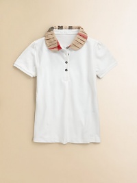 A checked, ruffled collar decorates this piqué polo style.Ruffled Peter Pan collarFront button placketShort sleeves95% cotton/5% elastaneMachine washImportedPlease note: Pattern may vary. A checked, ruffled collar decorates this piqué polo style.Ruffled Peter Pan collarFront button placketShort sleeves95% cotton/5% elastaneMachine washImportedPlease note: Pattern may vary.