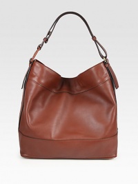 An effortlessly chic roomy silhouette made of rich, butter-soft leather. Single shoulder strap, 10 dropMagnetic snap closureProtective metal feetOne inside zip pocketTwo inside open pocketsFully lined14W X 13½H X 6½DMade in Italy An effortlessly chic roomy silhouette made of rich, butter-soft leather. Single shoulder strap, 10 dropMagnetic snap closureProtective metal feetOne inside zip pocketTwo inside open pocketsFully lined14W X 13½H X 6½DMade in Italy