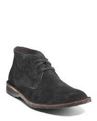 Leather lace up chukka boots with peace sign embossed. Contrast brown piping along the sole. Durable rubber sole for added grip. Slight heel. Leather lace up chukka boots with peace sign embossed. Contrast brown piping along the sole. Durable rubber sole for added grip. Slight heel.