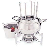 The All-Clad fondue set in in stainless steel and comes with a ceramic insert for dessert sauces and cheese. Includes 6 fondue forks. The All-Clad fondue set in in stainless steel and comes with a ceramic insert for dessert sauces and cheese. Includes 6 fondue forks.
