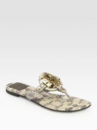 Gleaming signature hardware is at the center of this lizard-print leather sandal, with a rubber sole for added traction. Lizard-print leather upperLeather liningRubber solePadded insoleImported Gleaming signature hardware is at the center of this lizard-print leather sandal, with a rubber sole for added traction. Lizard-print leather upperLeather liningRubber solePadded insoleImported