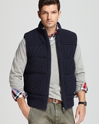 Cable knit with a stand collar and a full zip front, this sweater vest makes cooler weather easy to dress in. Cable knit with a stand collar and a full zip front, this sweater vest makes cooler weather easy to dress in.