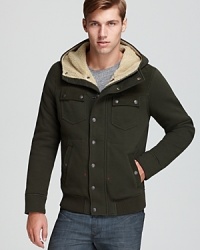 Military inspired and perfect for late fall, the Swayland jacket features a fleece-lined hood, metal snaps and a ribbed hem. Military inspired and perfect for late fall, the Swayland jacket features a fleece-lined hood, metal snaps and a ribbed hem.