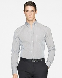 Rendered in smooth woven cotton for luxe comfort, a handsomely striped sport shirt is tailored for a trim, modern fit. Rendered in smooth woven cotton for luxe comfort, a handsomely striped sport shirt is tailored for a trim, modern fit.