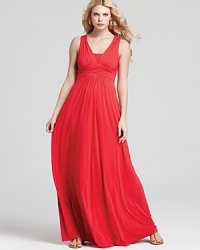 From the crisscross draping to the vibrant lipstick-red hue, this Nola Z dress exudes after-dark elegance. Complement the glamorous silhouette with gold garnishes. From the crisscross draping to the vibrant lipstick-red hue, this Nola Z dress exudes after-dark elegance. Complement the glamorous silhouette with gold garnishes.