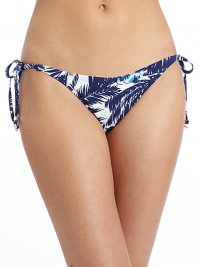 THE LOOKAllover palm leaf printSide ties with silvertone hardwareElastic waist and leg openingsTHE MATERIAL80% nylon/20% spandexFully linedCARE & ORIGINHand washMade in USAPlease note: Bikini top sold separately. THE LOOKAllover palm leaf printSide ties with silvertone hardwareElastic waist and leg openingsTHE MATERIAL80% nylon/20% spandexFully linedCARE & ORIGINHand washMade in USAPlease note: Bikini top sold separately.