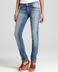 A heavily faded wash and embroidered pockets bring a rustic-chic aesthetic to these 7 For All Mankind skinny jeans. A heavily faded wash and embroidered pockets bring a rustic-chic aesthetic to these 7 For All Mankind skinny jeans.