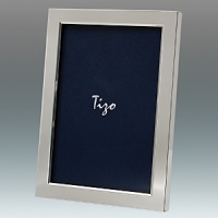 Hand crafted in Italy with a beautiful wooden back, this frame from Tizo features a classically elegant border formed of tarnish-resistant gleaming silverplate. Hand crafted in Italy with a beautiful wooden back, this frame from Tizo features a classically elegant border formed of tarnish-resistant gleaming silverplate.