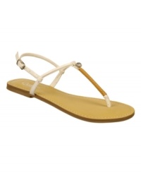 Adorn summer feet with the Twist sandals from Carlos by Carlos Santana. Featuring a single crystal at the vamp, these simple flat thong sandals are perfection.