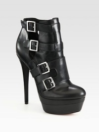 Surrounded by a plethora of adjustable buckles, this lustrous leather ankle boot has cutout sides, an island platform and ultra-high heel. Self-covered heel, 6 (150mm)Island platform, 1½ (40mm)Compares to a 4½ heel (115mm)Leather upperLeather lining and solePadded insoleImported Surrounded by a plethora of adjustable buckles, this lustrous leather ankle boot has cutout sides, an island platform and ultra-high heel. Self-covered heel, 6 (150mm)Island platform, 1½ (40mm)Compares to a 4½ heel (115mm)Leather upperLeather lining and solePadded insoleImported