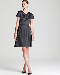 A little rock and roll, a little retro chic, this DKNY dress presents a polished punk that is devastatingly cool. A little rock and roll, a little retro chic, this DKNY dress presents a polished punk that is devastatingly cool.