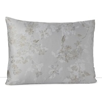 A soft floral in muted blue and taupe is scattered across a silvery grey background in this collection from Calvin Klein Home. A soft floral in muted blue and taupe is scattered across a silvery grey background in this collection from Calvin Klein Home.