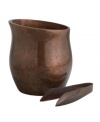 Crafted of alloy and finished in beautiful bronze, this Heritage Curve ice bucket set from Nambe keeps ice cubes on hand while adding old-world elegance and superior style to any buffet or cocktail setting.