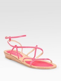 Vibrant leather staple with adjustable, ultra-skinny straps and a slightly stacked wedge. Leather upperLeather lining and solePadded insoleImported Vibrant leather staple with adjustable, ultra-skinny straps and a slightly stacked wedge. Leather upperLeather lining and solePadded insoleImported