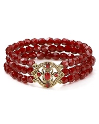 Three rows of rich garnet-hued glass stones, accented by an ornate 14-karat gold plated station define this Carolee bracelet that stretches for a perfect fit.