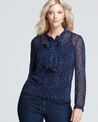 Send your style on an exotic quest with this MICHAEL Michael Kors Plus blouse, touting a sheer silhouette and a bold print for a sense of adventure. Send your style on an exotic quest with this MICHAEL Michael Kors Plus blouse, touting a sheer silhouette and a bold print for a sense of adventure.
