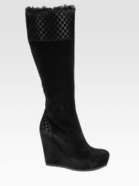 Suede wedge design topped with lamb fur and signature GG trim. Self-covered wedge, 4¼ (110mm)Self-covered platform, 1¼ (30mm)Compares to a 3 heel (75mm)Shaft, 15½Leg circumference, 15½Suede and lamb fur upperSide zipperLeather lining and solePadded insoleMade in Italy Suede wedge design topped with lamb fur and signature GG trim. Self-covered wedge, 4¼ (110mm)Self-covered platform, 1¼ (30mm)Compares to a 3 heel (75mm)Shaft, 15½Leg circumference, 15½Suede and lamb fur upperSide zipperLeather lining and solePadded insoleMade in Italy
