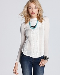 An homage to Victorian elegance, this Free People top features lovable lace detailing in pure white. An homage to Victorian elegance, this Free People top features lovable lace detailing in pure white.