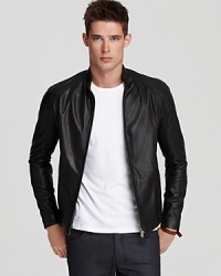 Unbelievably sleek in refined lambskin, this dramatic leather jacket emphasizes the excellence of its materials and balances style with effortless design. Unbelievably sleek in refined lambskin, this dramatic leather jacket emphasizes the excellence of its materials and balances style with effortless design.