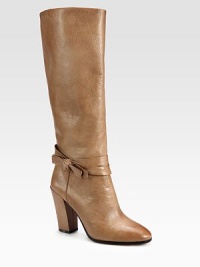 A feminine bow wraps around this tall silhouette, carefully constructed of ultra-soft leather. Self-covered heel, 4 (100mm)Shaft, 15Leg circumference, 13½Leather upperPull-on styleLeather liningLeather and rubber solePadded insoleImported A feminine bow wraps around this tall silhouette, carefully constructed of ultra-soft leather. Self-covered heel, 4 (100mm)Shaft, 15Leg circumference, 13½Leather upperPull-on styleLeather liningLeather and rubber solePadded insoleImported