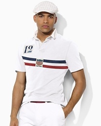 A trim-fitting rugby shirt is crafted from breathable cotton mesh with bold country embroidery in celebration of Team USA's participation in the 2012 Paralympic Games. A trim-fitting rugby shirt is crafted from breathable cotton mesh with bold country embroidery in celebration of Team USA's participation in the 2012 Paralympic Games.