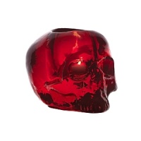 Designed by Ludvig Lofgren, this well-crafted glass skull makes a unique votive and its red color shimmers under the flicker of a candle. Designed by Ludvig Lofgren, this well-crafted glass skull makes a unique votive and its red color shimmers under the flicker of a candle.