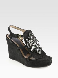 Make a grand entrance wearing this wedge sandal in rich suede, ornamented with elaborate rhinestones. Self-covered wedge, 4 (100mm)Suede upper with glass beads and rhinestonesAdjustable ankle strapLeather liningRubber solePadded insoleMade in Italy