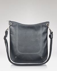 Its haute to be square with this Longchamp crossbody, styled in rich leather. A sized down shape sets this handbag apart as it effortlessly carries the out-and-about essentials. Its haute to be square with this Longchamp crossbody, styled in rich leather. A sized down shape sets this handbag apart as it effortlessly carries the out-and-about essentials.