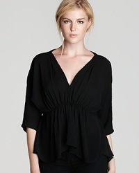 Sleekly chic for the hippie chick who's gone sophisticated, this ruched top features a subtly sexy deep v neck. Pair it with skinny jeans or a pencil skirt. Sleekly chic for the hippie chick who's gone sophisticated, this ruched top features a subtly sexy deep v neck. Pair it with skinny jeans or a pencil skirt.