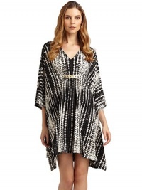 THE LOOKGraphic batik-inspired print on soft jerseyV-necklineRuched center with hammered metal ringsLong sleevesTHE FITAbout 35 from shoulder to hemTHE MATERIAL95% polyester/5% spandexCARE & ORIGINMachine washImportedModel shown is 5'11 (180cm) wearing US size Small. THE LOOKGraphic batik-inspired print on soft jerseyV-necklineRuched center with hammered metal ringsLong sleevesTHE FITAbout 35 from shoulder to hemTHE MATERIAL95% polyester/5% spandexCARE & ORIGINMachine washImportedModel shown is 5'11 (180cm) wearing US size Small.