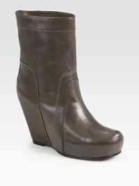 Rich Italian leather with a covered wedge and platform can be paired with a feminine dress or pair of jean shorts. Self-covered wedge, 4 (100mm)Covered platform, 1 (25mm)Compares to a 3 heel (75mm)Leather upperPull-on styleLeather lining and solePadded insoleMade in ItalyOUR FIT MODEL RECOMMENDS ordering one half size up as this style runs small. Rich Italian leather with a covered wedge and platform can be paired with a feminine dress or pair of jean shorts. Self-covered wedge, 4 (100mm)Covered platform, 1 (25mm)Compares to a 3 heel (75mm)Leather upperPull-on styleLeather lining and solePadded insoleMade in ItalyOUR FIT MODEL RECOMMENDS ordering one half size up as this style runs small.