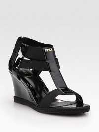 Glassy patent leather wedge enriched by rope trim, comfortable elastic straps and a goldtone nameplate. Patent leather and rope wedge, 3 (75mm)Patent leather and elastic upperLeather liningRubber solePadded insoleMade in ItalyOUR FIT MODEL RECOMMENDS ordering true size. Glassy patent leather wedge enriched by rope trim, comfortable elastic straps and a goldtone nameplate. Patent leather and rope wedge, 3 (75mm)Patent leather and elastic upperLeather liningRubber solePadded insoleMade in ItalyOUR FIT MODEL RECOMMENDS ordering true size.