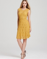 In a golden hue and delicate lace, BCBGMAXAZRIA's seamed lace dress lends a soft, feminine look. In a golden hue and delicate lace, BCBGMAXAZRIA's seamed lace dress lends a soft, feminine look.