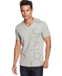 A v-neck paired with a Calvin Klein logo graphic give this tee a classic style. A v-neck paired with a Calvin Klein logo graphic give this tee a classic style.