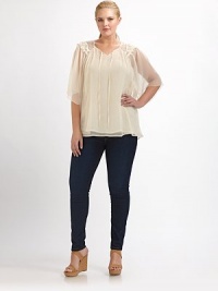 Crochet and lace add romantic appeal to this airy design with a self-tie neckline and ultra-feminine flutter sleeves.Self-tie detail at v-neckSheer flutter sleevesLovely crochet and lace detailsAbout 30 from shoulder to hemViscoseDry cleanMade in USA Crochet and lace add romantic appeal to this airy design with a self-tie neckline and ultra-feminine flutter sleeves.Self-tie detail at v-neckSheer flutter sleevesLovely crochet and lace detailsAbout 30 from shoulder to hemViscoseDry cleanMade in USA