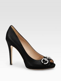Sophisticated peep-toe classic, with silvertone horsebit, impeccably crafted in Italian leather.Self-covered heel, 4½ (115mm) Self-covered platform, ¾ (20mm) Compares to a 3¾ heel (95mm) Leather lining and sole Padded insole Made in ItalyOUR FIT MODEL RECOMMENDS ordering true size. Sophisticated peep-toe classic, with silvertone horsebit, impeccably crafted in Italian leather.Self-covered heel, 4½ (115mm) Self-covered platform, ¾ (20mm) Compares to a 3¾ heel (95mm) Leather lining and sole Padded insole Made in ItalyOUR FIT MODEL RECOMMENDS ordering true size.