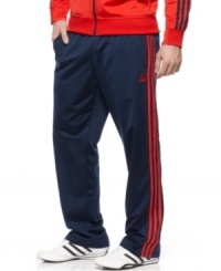 Hit your stride in style. You'll be ready to take every pass to the basket in these comfortable tricot track pants from adidas. Hit your stride in style. You'll be ready to take every pass to the basket in these comfortable tricot track pants from adidas.