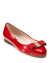 You don't have to be uncomfortable to look fashionable. Try these patent leather ballet flats with a classic Ferragamo bow and logo plate at toe. You don't have to be uncomfortable to look fashionable. Try these patent leather ballet flats with a classic Ferragamo bow and logo plate at toe.
