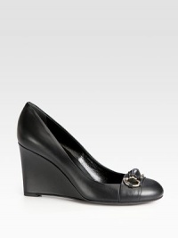 A signature bamboo-inspired horsebit adorns this leather wedge silhouette. Self-covered wedge, 3½ (90mm)Leather upperLeather lining and solePadded insoleMade in Italy A signature bamboo-inspired horsebit adorns this leather wedge silhouette. Self-covered wedge, 3½ (90mm)Leather upperLeather lining and solePadded insoleMade in Italy
