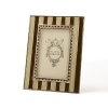 Olivia Riegel striped enamel frame. Highly collectable, this hand-finished frame combines classic lines with modern sophistication. Wide chocolate and cream colored enameled stripes are punctuated by jonquil and smoked topaz Swarovski crystals, adding mystery and romance to any 4x6 photo.