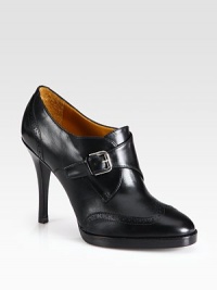 Impeccably tailored leather silhouette with perforated detailing and an adjustable buckle clasp. Stacked heel, 4 (100mm)Leather upperLeather lining and solePadded insoleMade in Italy