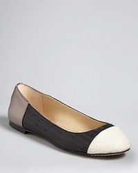 Dolce Vita takes the colorblocking trend to the next level with intricately textured leather, finished off with boldly colored, snake-embossed cap toes. Dolce Vita takes the colorblocking trend to the next level with intricately textured leather, finished off with boldly colored, snake-embossed cap toes.