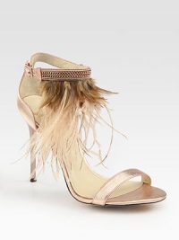 Shimmering metallic leather straps embellished by an array of exotic feathers. Self-covered heel, 4 (100mm)Metallic leather and feather upperAdjustable ankle strapLeather lining and solePadded insoleMade in ItalyOUR FIT MODEL RECOMMENDS ordering true size. Shimmering metallic leather straps embellished by an array of exotic feathers. Self-covered heel, 4 (100mm)Metallic leather and feather upperAdjustable ankle strapLeather lining and solePadded insoleMade in ItalyOUR FIT MODEL RECOMMENDS ordering true size.